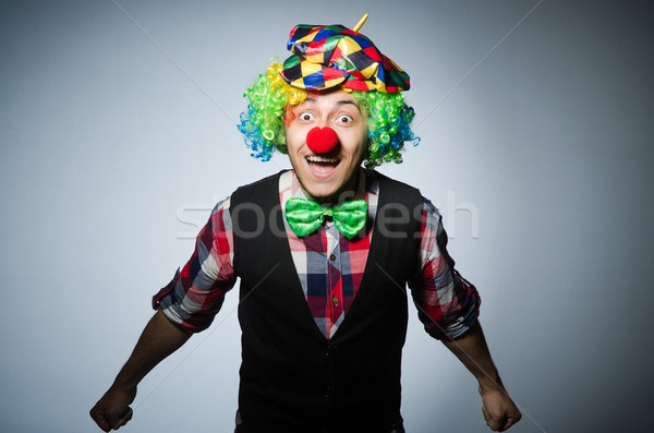 Funny clown against the dark background Stock photo © Elnur