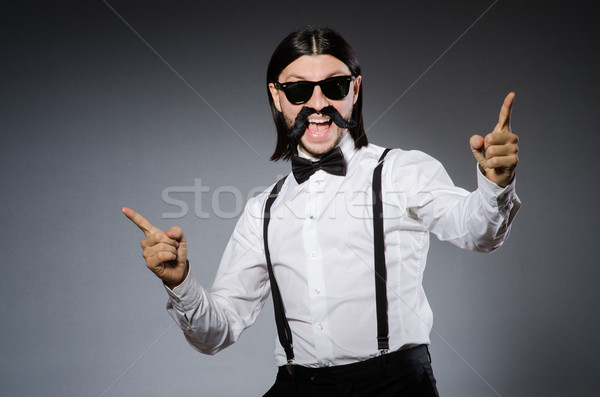 Hombre bigote gafas de sol gris fondo estudio Foto stock © Elnur