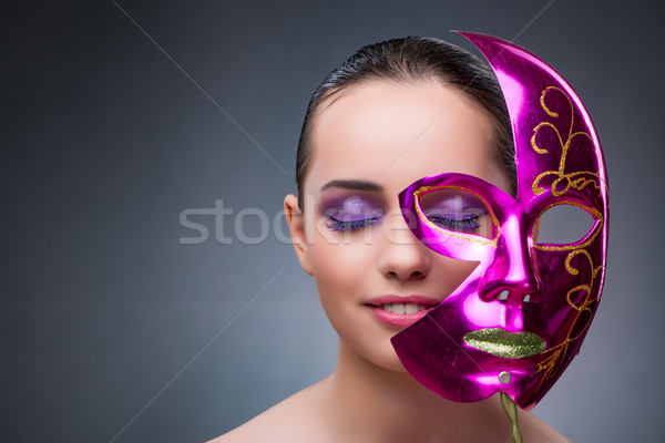 Young woman with carnival mask Stock photo © Elnur