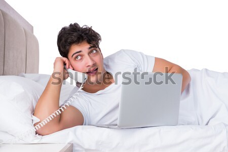 Homme lit souffrance insomnie téléphone portable [[stock_photo]] © Elnur