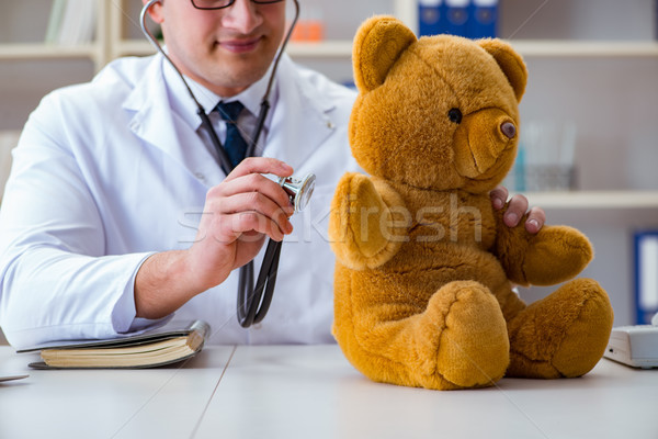 Doctor veterinary pediatrician holding an examination in the off Stock photo © Elnur