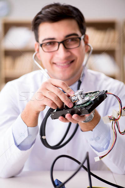 Proffesional repairman repairing broken hard drive Stock photo © Elnur