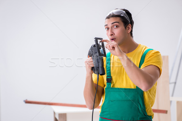 Contractor working on laminate wooden floor Stock photo © Elnur
