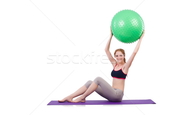 Woman exercising with swiss ball on white Stock photo © Elnur