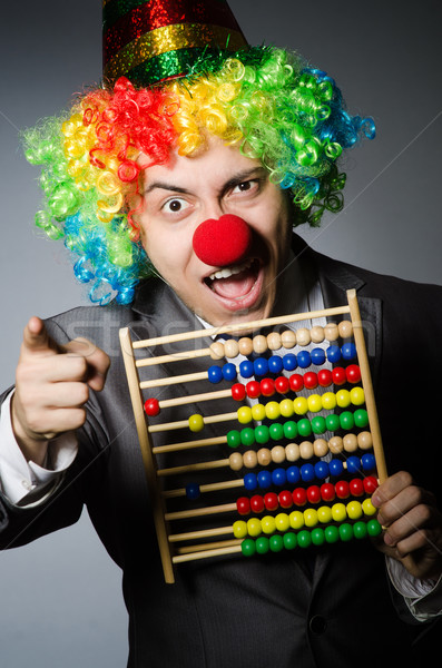 Funny clown businessman with abacus Stock photo © Elnur