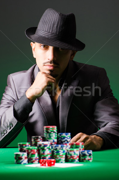 Homme jouer sombre casino vert costume [[stock_photo]] © Elnur