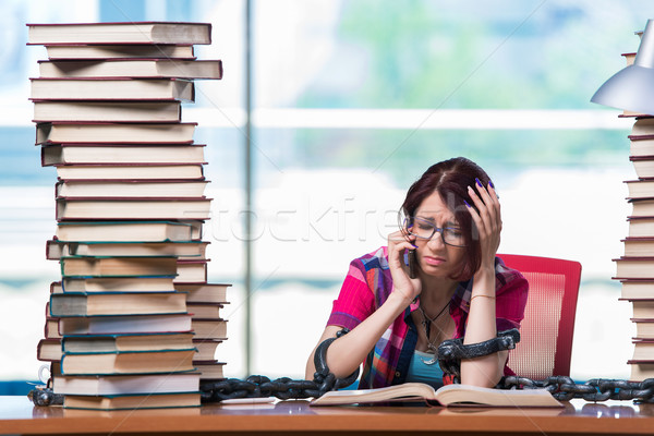 Stock photo: Young female student preparing for exams
