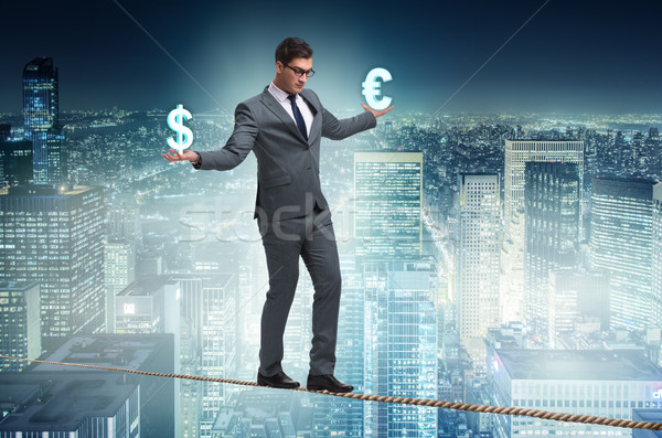 Businessman balancing between choosing dollar and euro Stock photo © Elnur