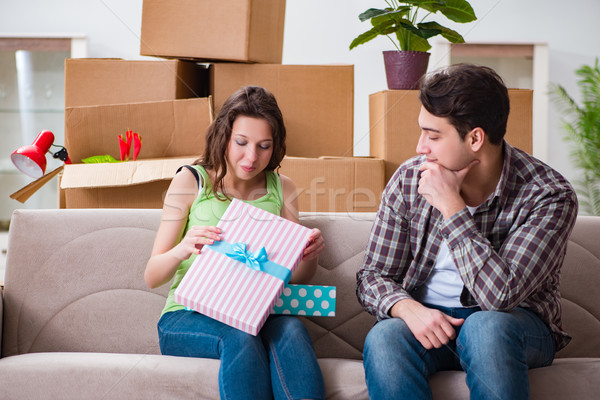 Stock photo: Young couple of man and pregnant wife with giftbox