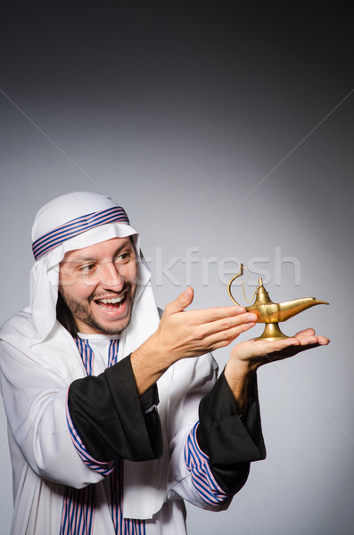 Arab with lamp in studio Stock photo © Elnur