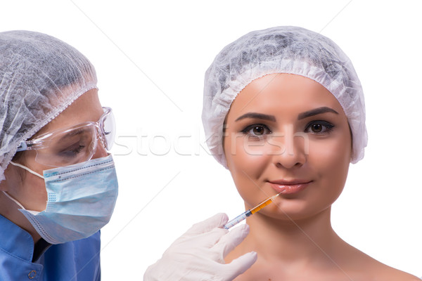 Młoda kobieta wstrzykiwań botox odizolowany biały kobieta Zdjęcia stock © Elnur