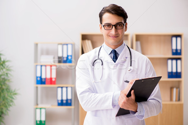 Young adult doctor working in the hospital Stock photo © Elnur