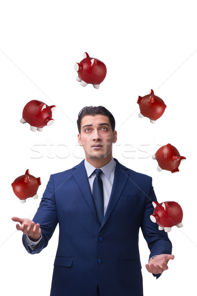 Businessman juggling with piggybanks in business concept Stock photo © Elnur