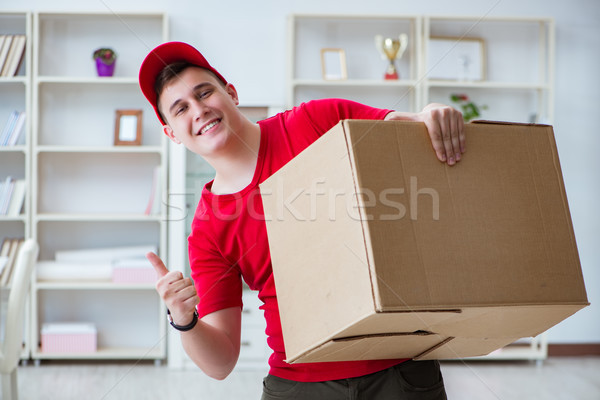 Post man delivering a parcel package Stock photo © Elnur