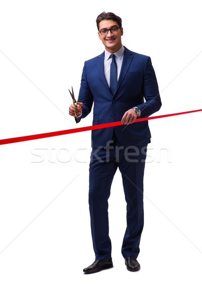 Businessman cutting red ribbon isolated on white Stock photo © Elnur