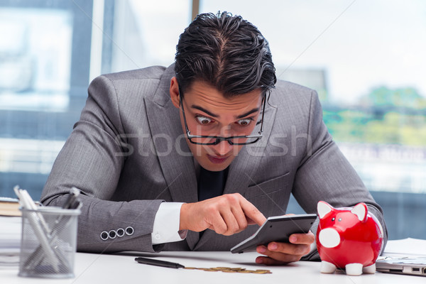 Bankrupt broke businessman with piggy bank Stock photo © Elnur