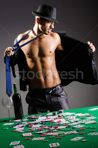 Naked broke businessman in casino Stock photo © Elnur