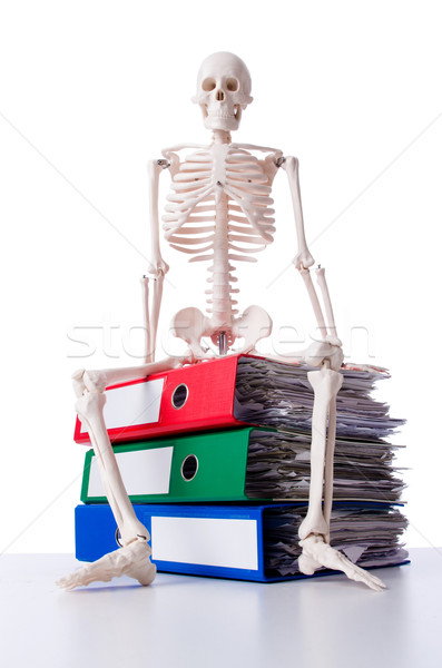 Stock photo: Skeleton with pile of files on white