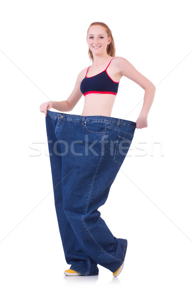 Woman with large jeans in dieting concept Stock photo © Elnur