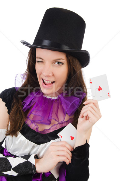 Pretty girl in jester costume with cards isolated on white Stock photo © Elnur