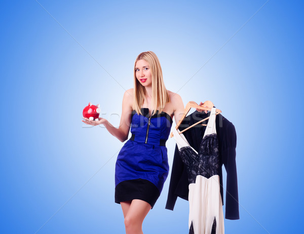 Woman thinking of spending her savings on clothing Stock photo © Elnur