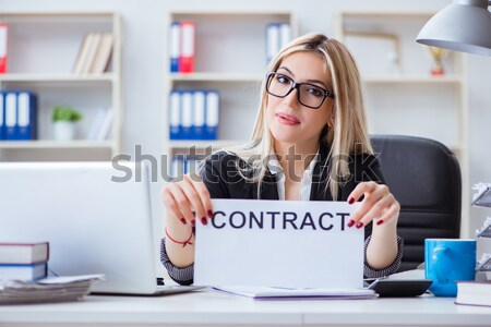 Businesswoman sitting at her desk in business concept Stock photo © Elnur