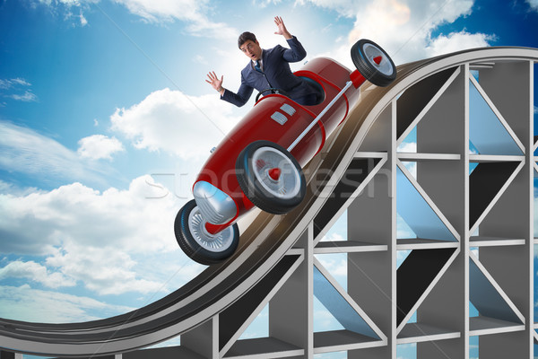 Businessman driving sports car on roller coaster Stock photo © Elnur