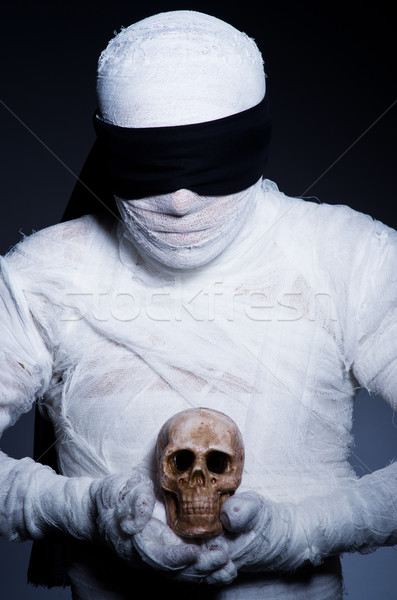 Mummy with skull in dark room Stock photo © Elnur