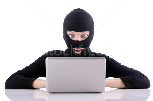 Hacker with computer wearing balaclava Stock photo © Elnur