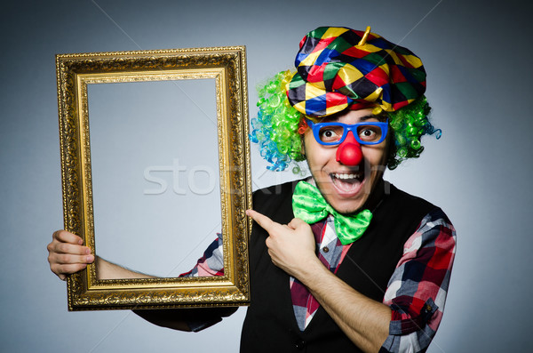 Funny clown with picture frame Stock photo © Elnur