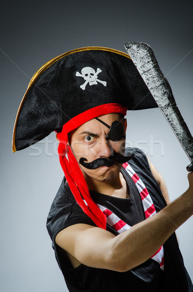 Funny pirate in the dark studio Stock photo © Elnur