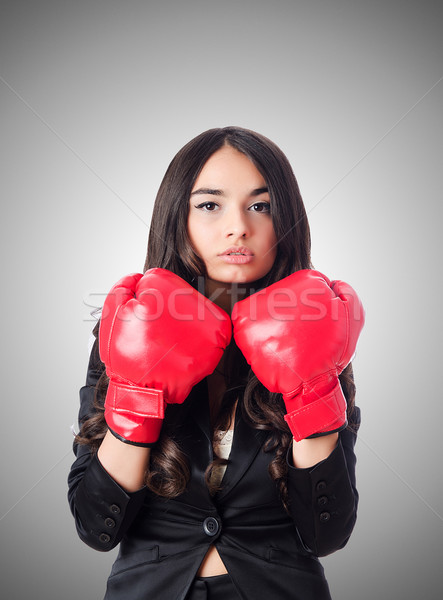 Young woman with boxing glove Stock photo © Elnur