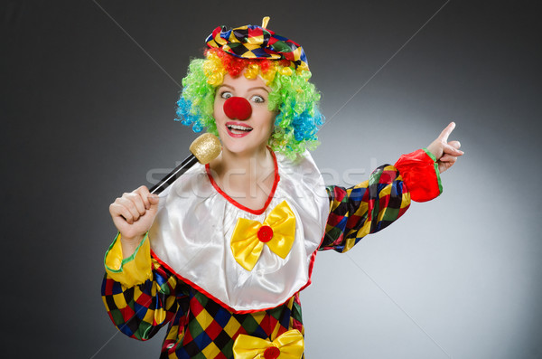 Clown with mic in funny concept Stock photo © Elnur