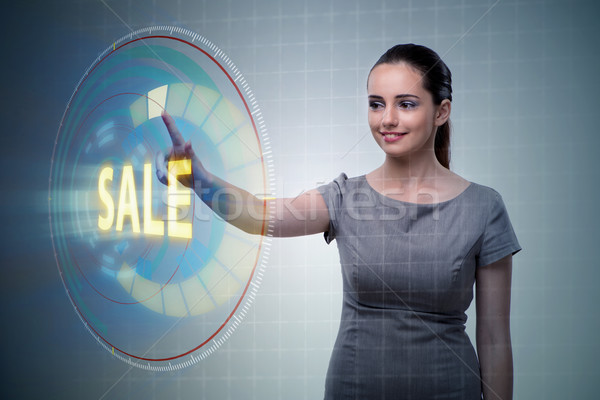 Stock photo: Businesswoman pressing buttons in sale concept