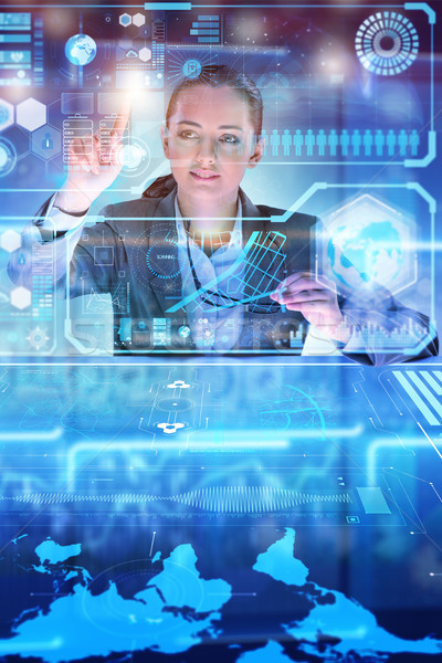 Stock photo: Woman analyst working with big data