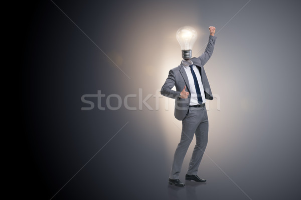 Businessman in new idea concept with light bulb Stock photo © Elnur