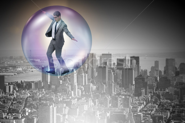 Stock photo: The businessman flying inside the bubble