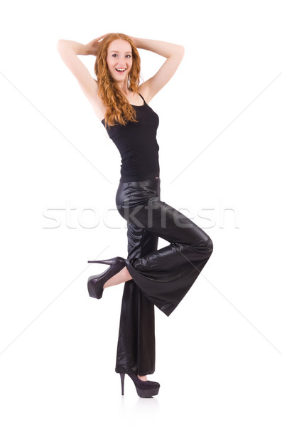 Redhead woman in black bell bottom pants on white Stock photo © Elnur