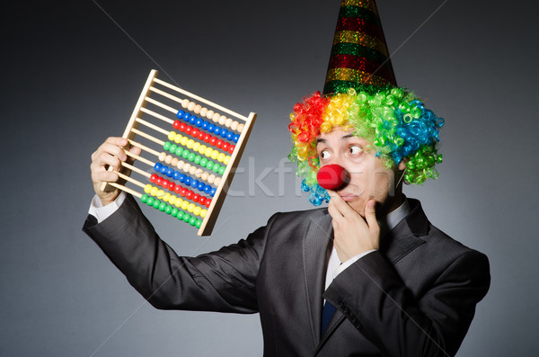 Funny clown businessman with abacus Stock photo © Elnur