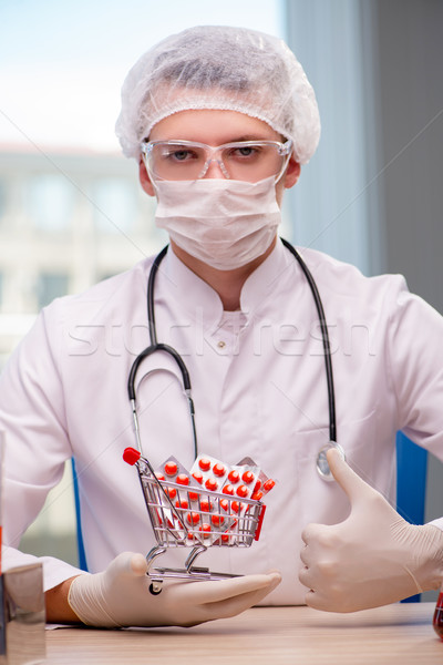 The doctor with shopping cart full of pills  Stock photo © Elnur