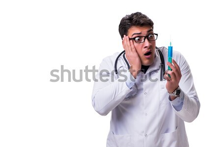 Young male cardiologist doctor holding a heart isolated on white Stock photo © Elnur