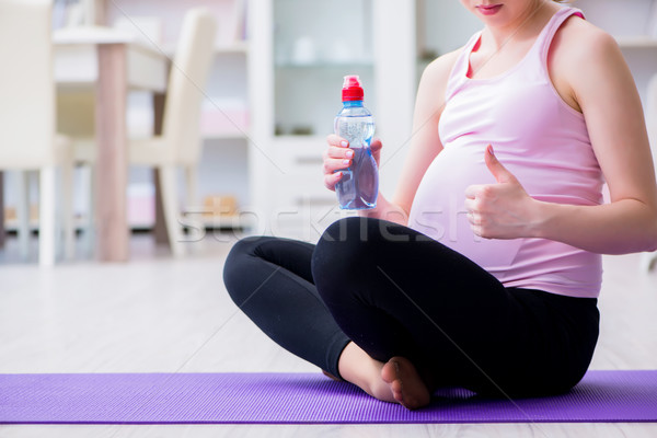 Pregnant woman exercising in anticipation of child birth Stock photo © Elnur
