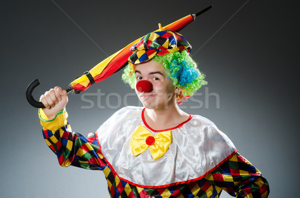 Funny clown with colourful umbrella Stock photo © Elnur