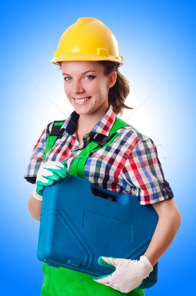 Young woman with toolkit on white Stock photo © Elnur