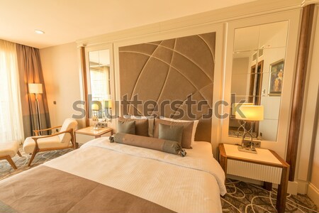 Modern hotel room with big bed Stock photo © Elnur