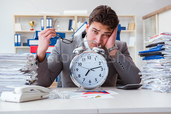 Businessman missing deadlines due to excessive work Stock photo © Elnur