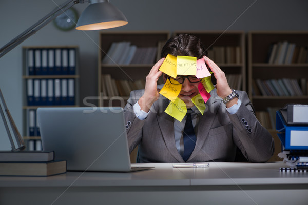 Businessman staying late to sort out priorities Stock photo © Elnur