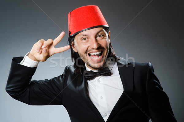 Stock photo: Man in traditional turkish hat and dress