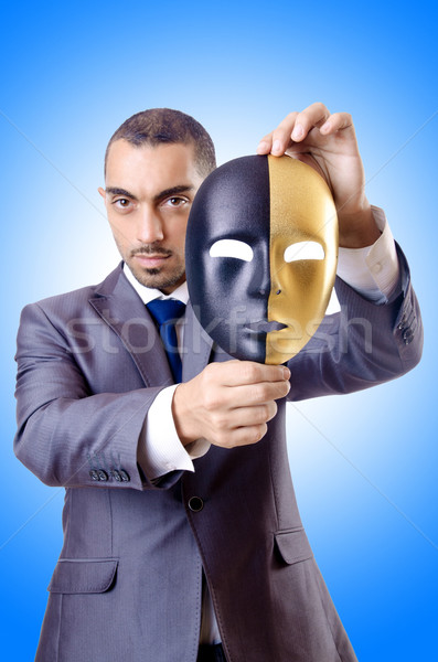 Businessman with mask in hypocrisy concept Stock photo © Elnur