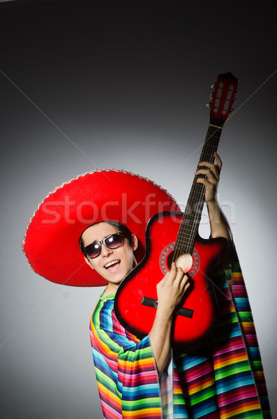 Man in red sombrero playing guitar Stock photo © Elnur